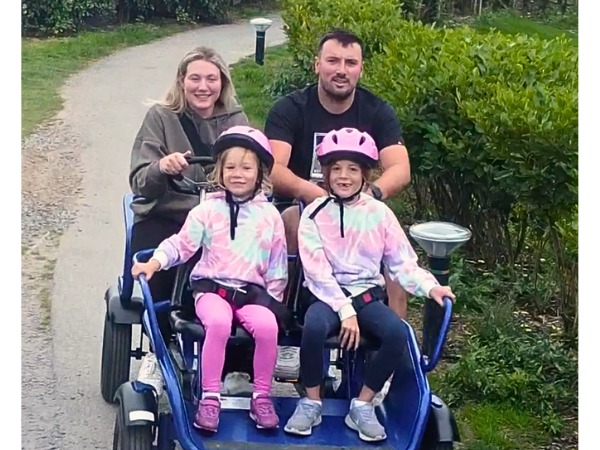 Family enjoying Adevnturer pedal kart at Hafan Y Mor, Haven Holiday Park
