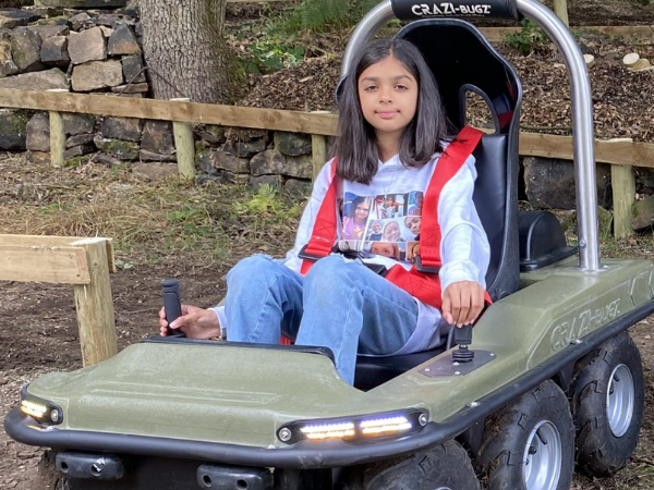 Guest using Crazi-Bugz electric ride-on vehicles at Holme Valley Caravan Park